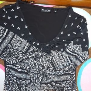 multi patterned top with gathered waist.